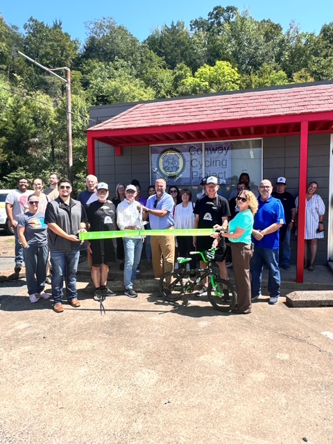 Ribbion cutting ceremony celebrating the opening of the new location.